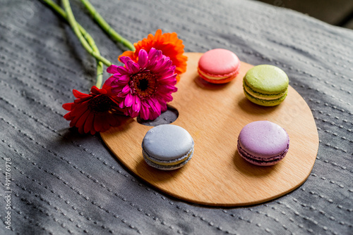 French macarons and colorful flowers