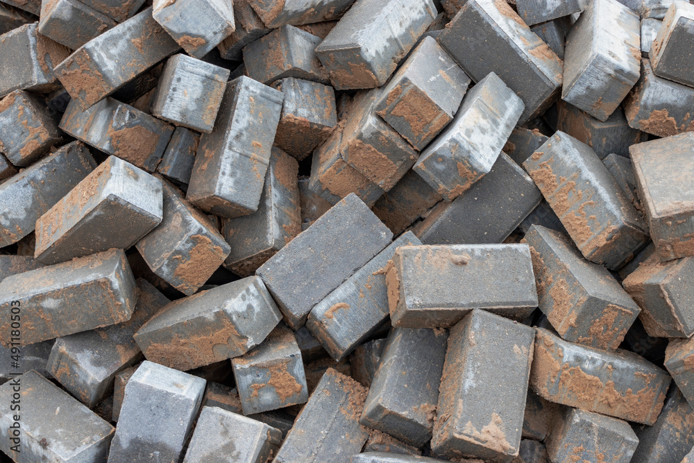 Dismantled paving slabs. Reconstruction of the sidewalk in the city. Construction work on the improvement of the territory. Close-up. Background. Dismantled paving slabs. Reconstruction of the sidewalk in the city. Construction work on the improvement of the territory. Close-up. Background.