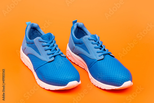 shoes on orange background. shoe store. shopping concept. footwear for training.