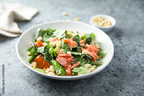 Traditional Caesar salad with salmon
