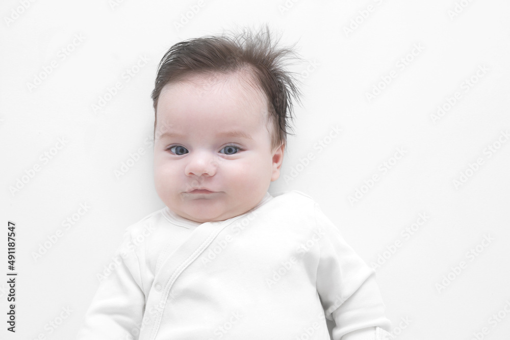Adorable baby boy two months old isolated on a white background Adorable baby boy two months old isolated on a white background