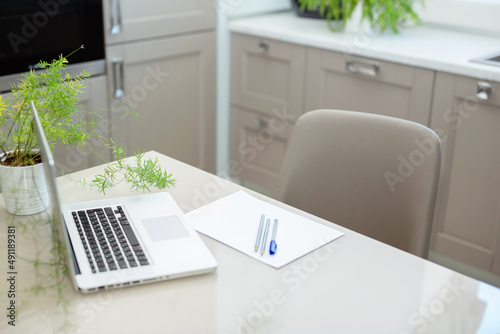 business analyzing concept. financial analyst typing on laptop close up without face