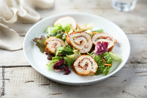 Homemade chicken roulade with salad
