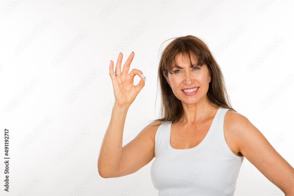 portrait senior woman with okey gesture on white background portrait senior woman with okey gesture on white background
