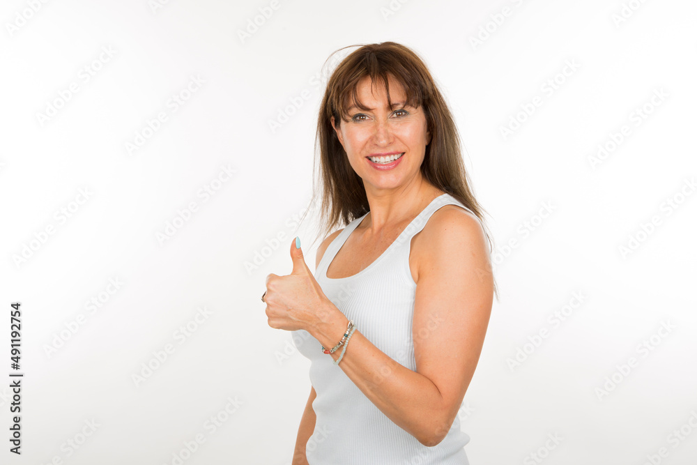 portrait senior woman with thumbs up being positive smiling on white background portrait senior woman with thumbs up being positive smiling on white background