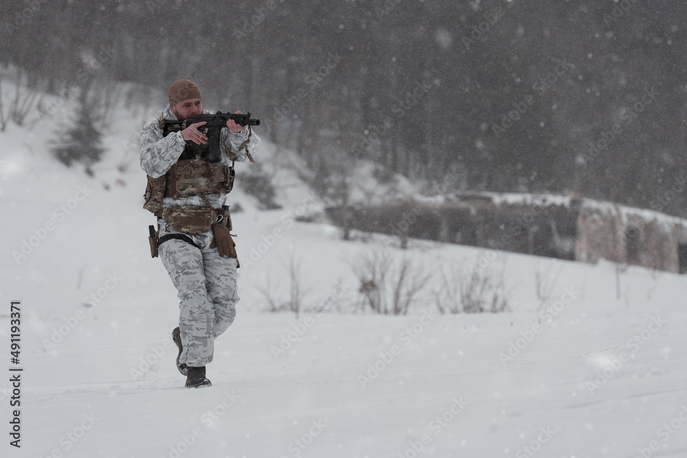 Soldier in winter camouflaged uniform in Modern warfare army on a snow day on forest battlefield with a rifle. Model face very similar to Ukraine prime minister.