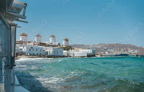 Fotobehang Sightings of Mykonos Island in Greece are of vivid whitewashed houses with vibra