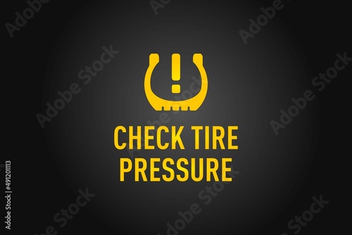 Check Tire Pressure warning on a black background
