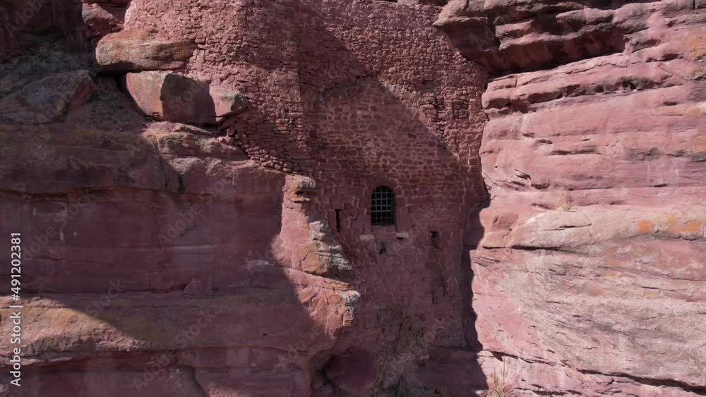 Aerial drone view of the secret door of the Peracense castle in Teruel, Spain. Built in red sandstone. Backward view. Aerial drone view of the secret door of the Peracense castle in Teruel, Spain. Built in red sandstone. Backward view.