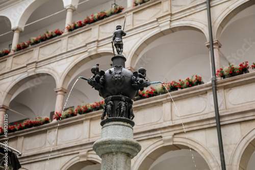 Linz, Austria, 29 August 2021: Landhaus Parliament of Upper Austria, Facade of colorful baroque buildings in historic center of medieval city, summer day, fountain Planetenbrunnen, renaissance arcades photo