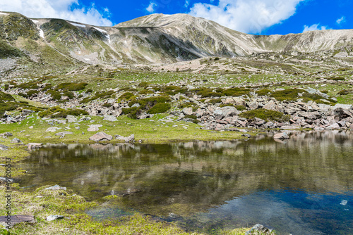 Lake in the mountains  Peak of Bastiments  Pyrenees Mountains 