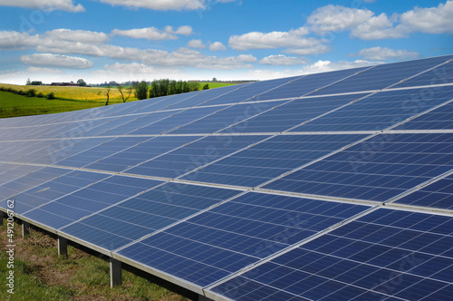 Rows of solar panels and green nature