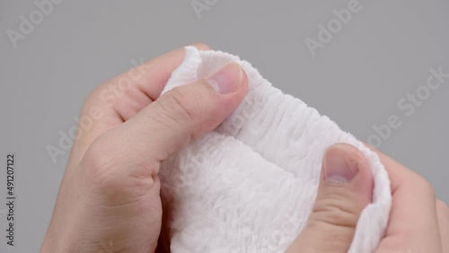 Pile of baby diaper panties diaper isolated on background, close-up, copy space, infant