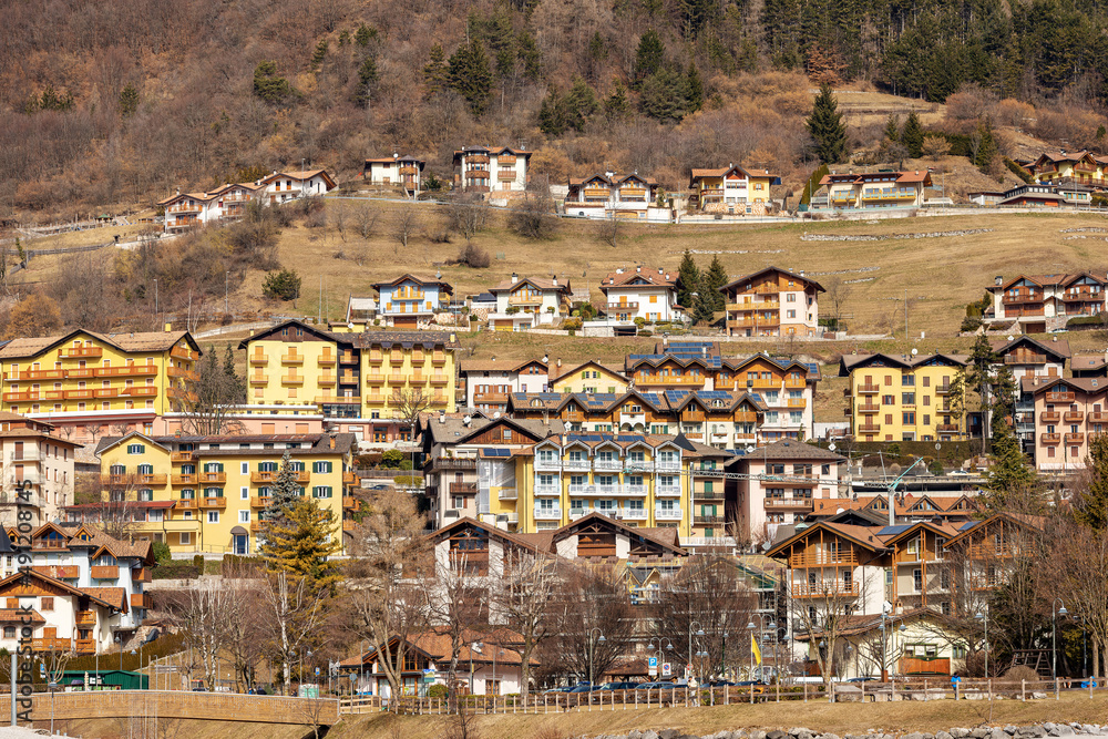 Obraz premium Molveno village, tourist resort on the coast of the lake Molveno, Italian Alps, Brenta Dolomites, National Park of Adamello Brenta. Trentino Alto Adige, Trento, Italy, Europe.
