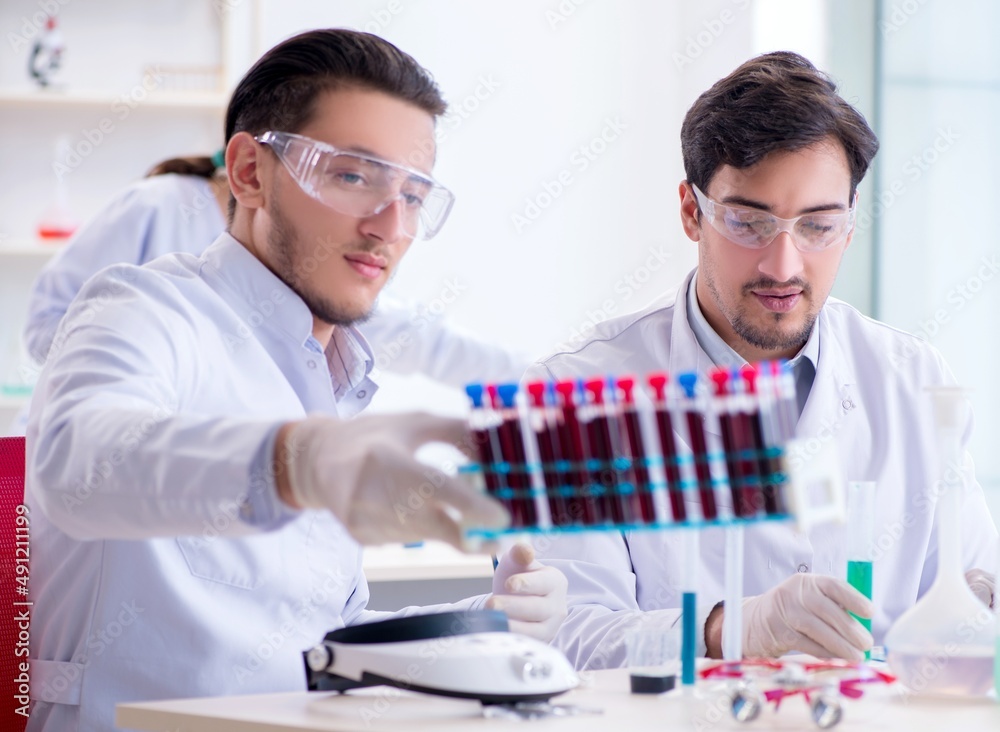 Team of chemists working in the lab Team of chemists working in the lab
