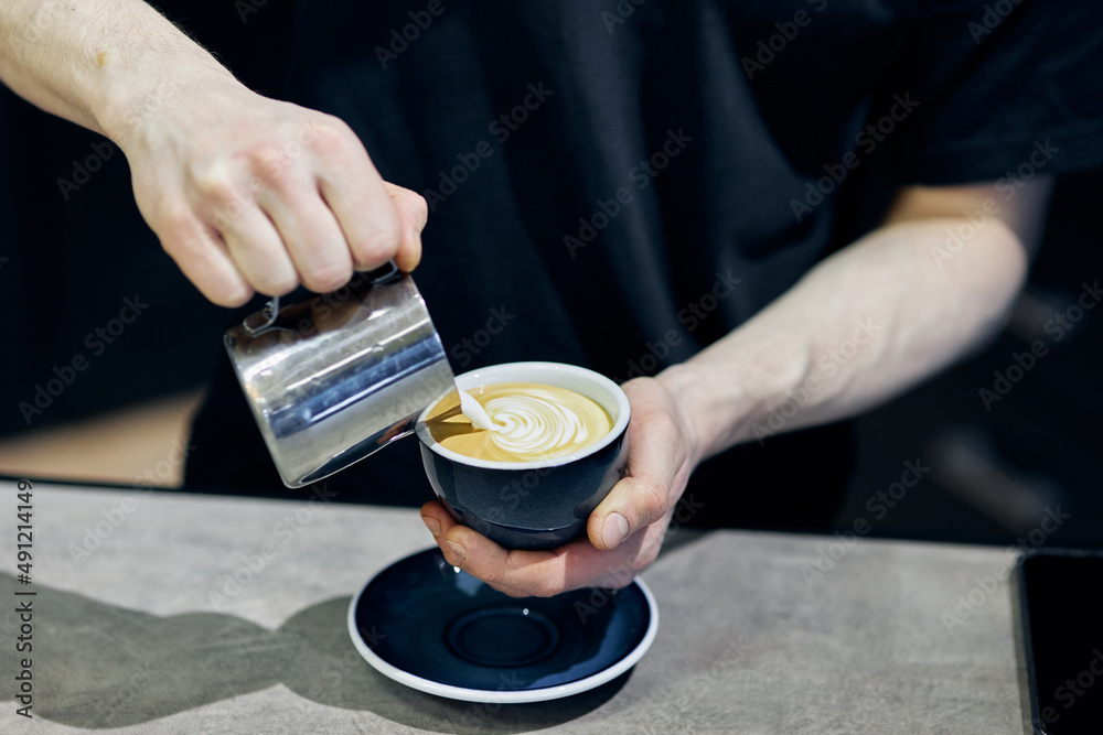 person holding a cup of coffee person holding a cup of coffee