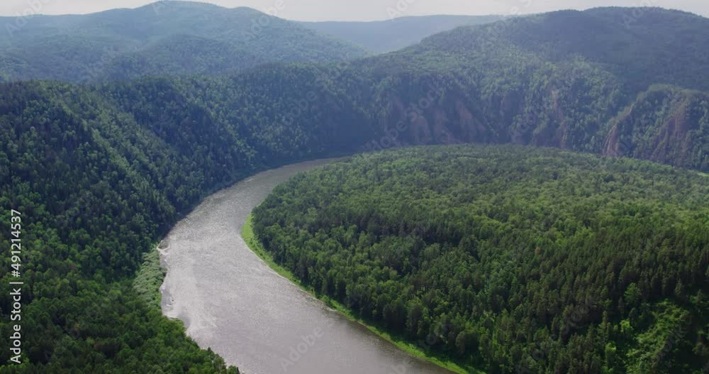 Flight over the river in the taiga on a drone Flight over the river in the taiga on a drone