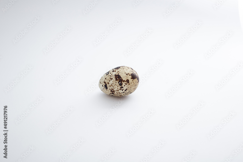 Quail eggs lie on a white background Quail eggs lie on a white background