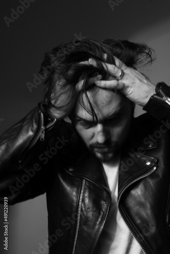 Black and white portrait of man with anxiety and depression. Vertical.