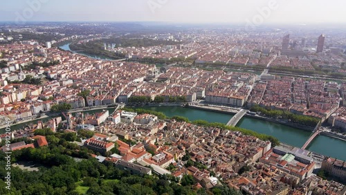 Lyon panorama from Fourviere hill, old town, presqu'ile peninsula, Part-Dieu city center, Rhone and Saone rivers, France. Aerial footage of famous touristic landmarks. Sunny warm summer day, blue sky