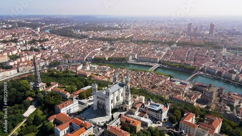 Lyon panorama with Fourviere basilica, Part-Dieu city center Rhone and Saone rivers, France. Aerial footage of famous touristic landmarks, French city of lights. Sunny warm summer day, blue sky.