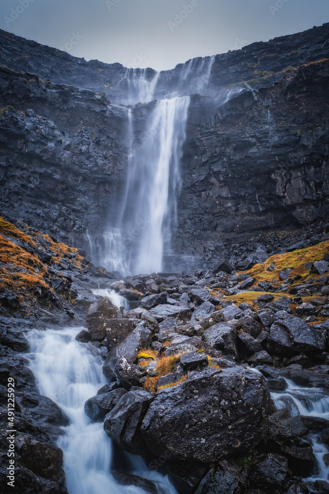 Obraz premium Fossa Waterfall on island Bordoy. This is the highest waterfall in the Faroe Islands, situated in wild scandinavian scenery. November 2021