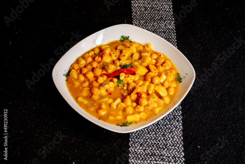 Moroccan-style chickpea stew with ras el hanout and peppers photo