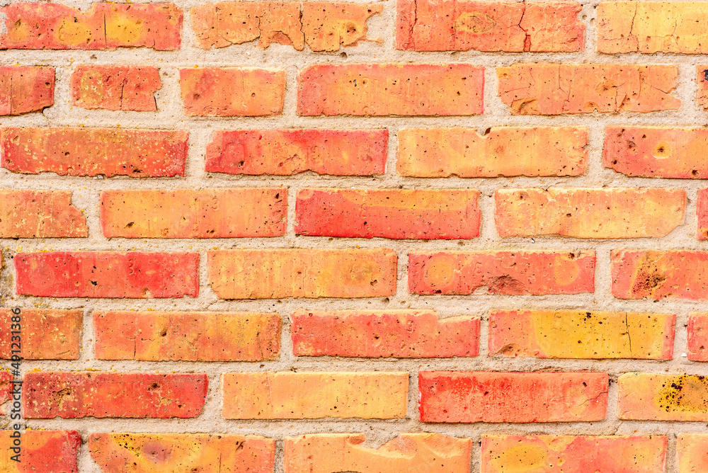 Brick wall with orange brick. Orange brick background