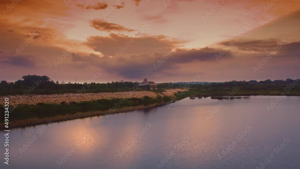 Beautiful Evening Sky Reflection On The Lake Water And Temple on Rocks in 4K Beautiful Evening Sky Reflection On The Lake Water And Temple on Rocks in 4K