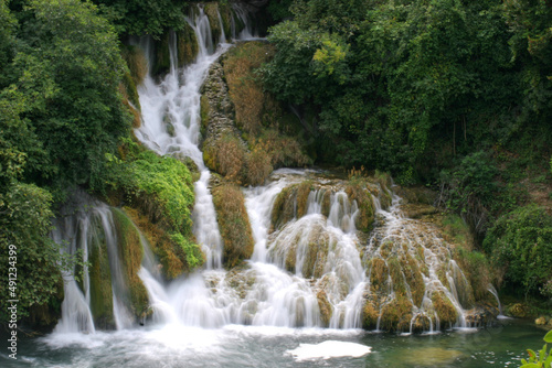 Beautiful waterfall with green vegetation in Croatia 