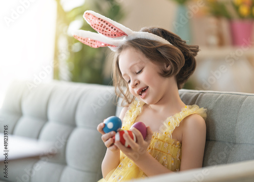 child with Easter painting eggs © Konstantin Yuganov