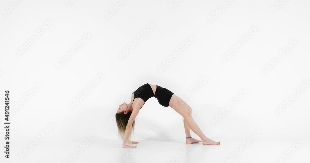 Blonde woman doing yoga exercise in studio closeup Blonde woman doing yoga exercise in studio closeup