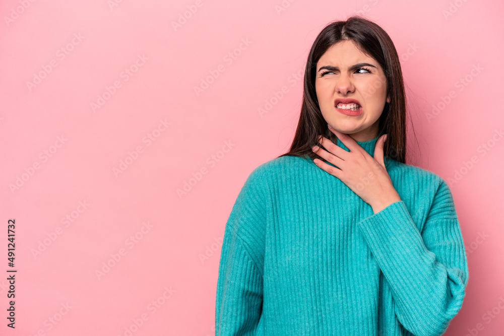 Young caucasian woman isolated on pink background touching back of head, thinking and making a choice. Young caucasian woman isolated on pink background touching back of head, thinking and making a choice.