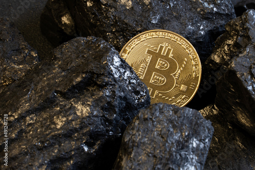 Gold coin bitcon and coal.