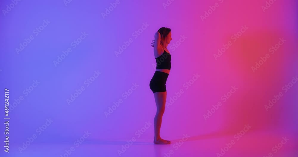 Blonde woman doing yoga exercise in studio closeup Blonde woman doing yoga exercise in studio closeup