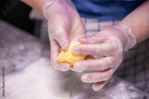 hands holding dough