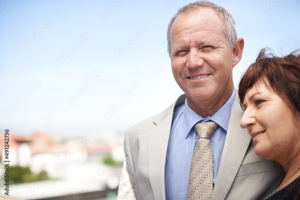 She makes his life complete. An affectionate mature couple embracing against a scenic view of the city - copyspace. She makes his life complete. An affectionate mature couple embracing against a scenic view of the city - copyspace.