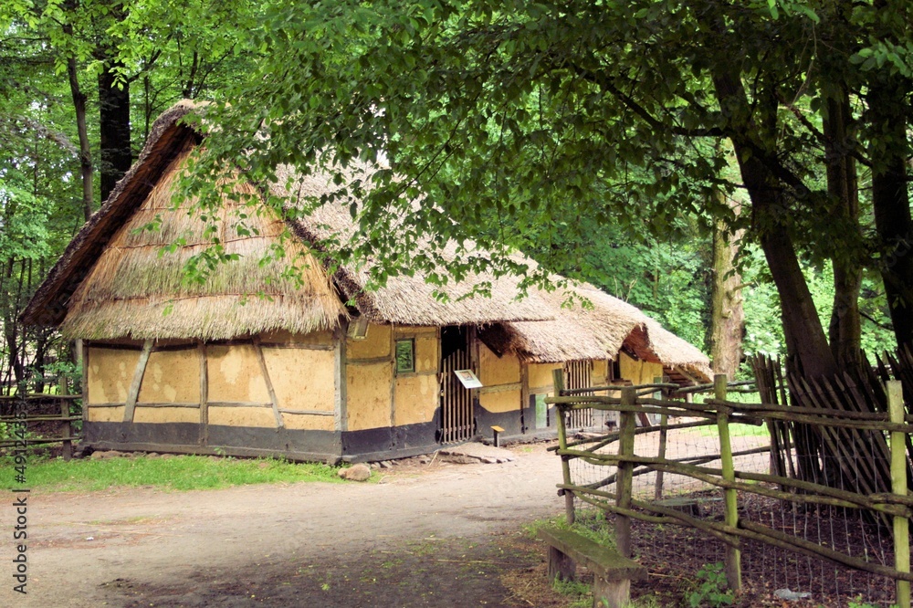 Obraz premium ancient yellow barn in a rural landscape, Bokrijk, Belgium