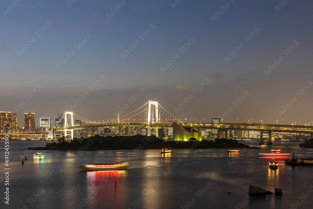 Japan, Kanto Region, Tokyo, Long exposure of Tokyo Bay at dusk with Rainbow Bridge in background Japan, Kanto Region, Tokyo, Long exposure of Tokyo Bay at dusk with Rainbow Bridge in background