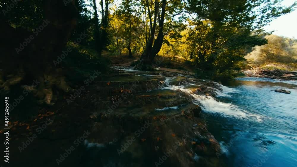 Flight on a drone over a mountain river. Low flight over a river. Low flight over natural spring water with FPV drone. magical forest river.meditation, sanctuary, solace, solitude, tranquillity 4K Flight on a drone over a mountain river. Low flight over a river. Low flight over natural spring water with FPV drone. magical forest river.meditation, sanctuary, solace, solitude, tranquillity 4K
