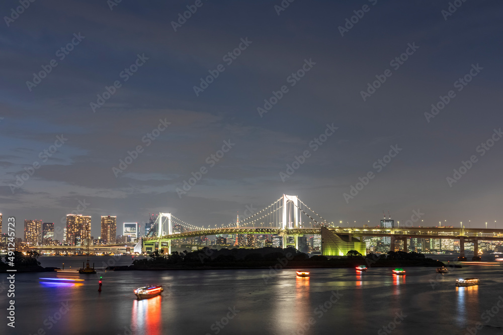Japan, Kanto Region, Tokyo, Long exposure of Tokyo Bay and Rainbow Bridge at dusk Japan, Kanto Region, Tokyo, Long exposure of Tokyo Bay and Rainbow Bridge at dusk