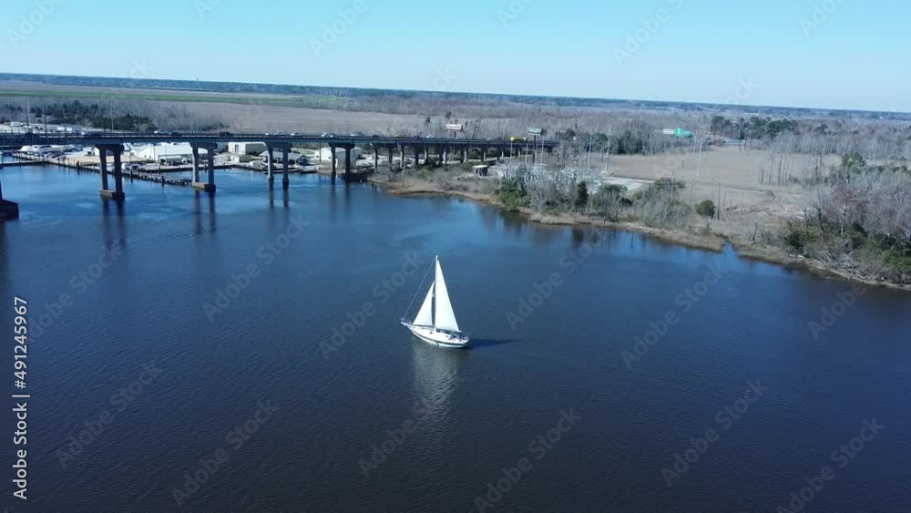 custom made wallpaper toronto digitalAerial view of sailboat on Cape Fear River in Wilmington, NC heading to Atlantic Ocean