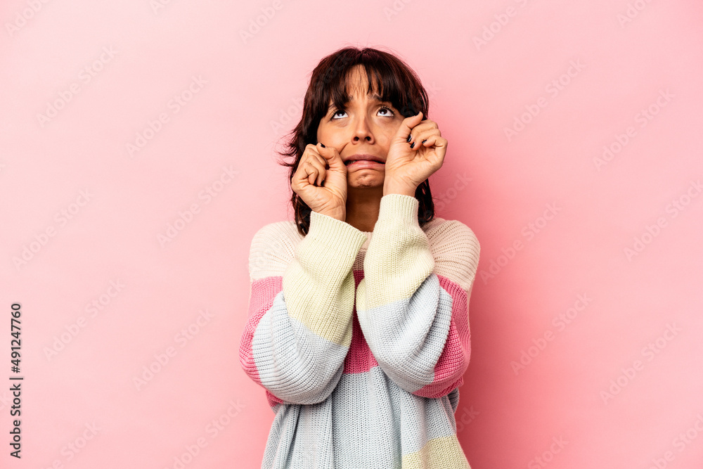 Young hispanic woman isolated on pink background whining and crying disconsolately. Young hispanic woman isolated on pink background whining and crying disconsolately.