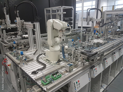 Assembly line with a robot arm in a Lab photo
