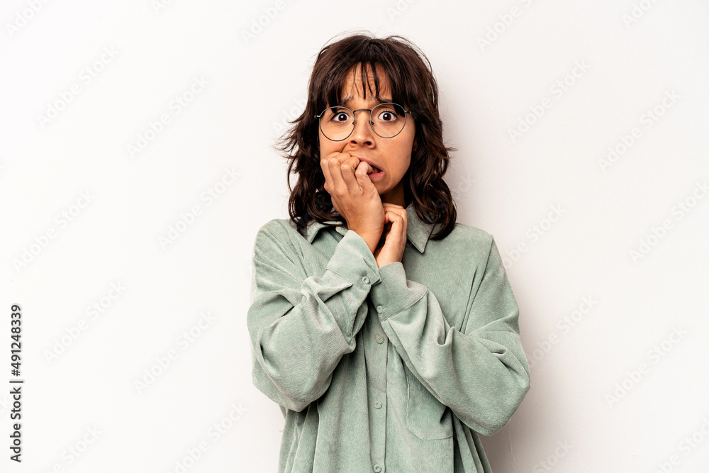 Young hispanic woman isolated on white background biting fingernails, nervous and very anxious. Young hispanic woman isolated on white background biting fingernails, nervous and very anxious.