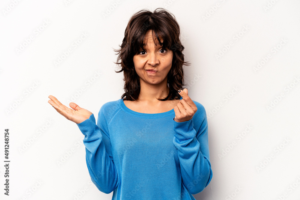 Young hispanic woman isolated on white background showing that she has no money. Young hispanic woman isolated on white background showing that she has no money.