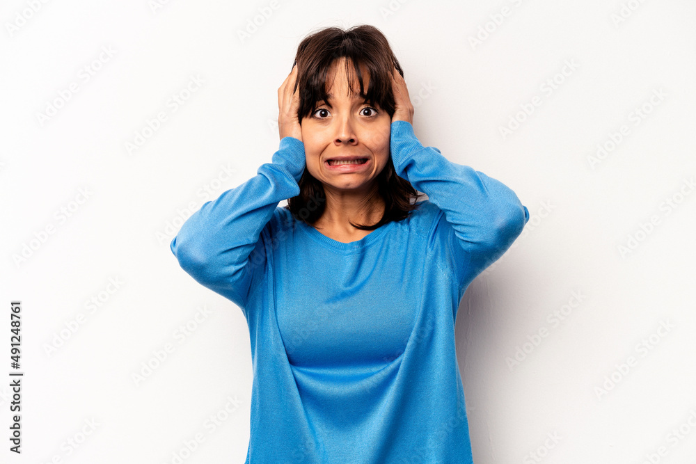 Young hispanic woman isolated on white background being shocked, she has remembered important meeting. Young hispanic woman isolated on white background being shocked, she has remembered important meeting.