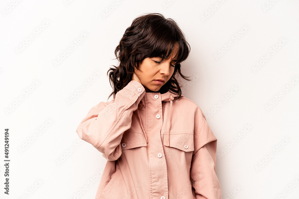 Young hispanic woman isolated on white background massaging elbow, suffering after a bad movement. Young hispanic woman isolated on white background massaging elbow, suffering after a bad movement.