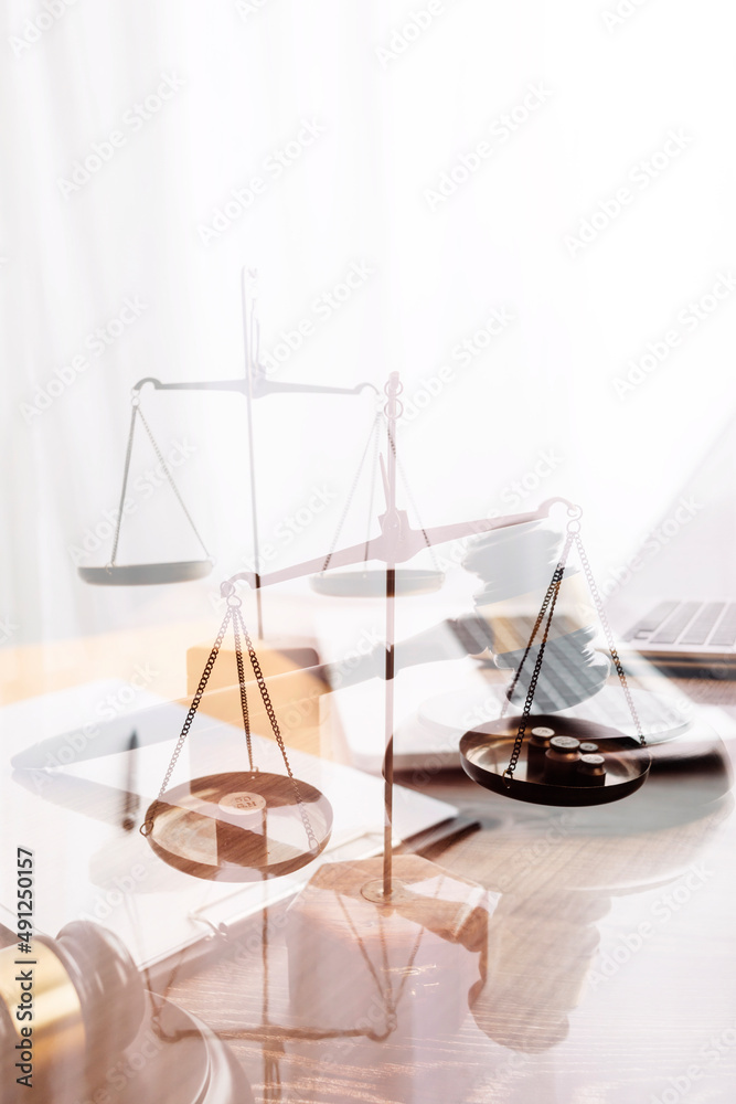 Male lawyer working with contract papers and wooden gavel on tabel in courtroom. justice and law ,attorney, court judge, concept. Male lawyer working with contract papers and wooden gavel on tabel in courtroom. justice and law ,attorney, court judge, concept.