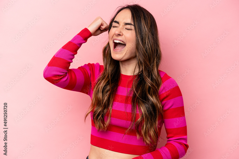 Young caucasian woman isolated on pink background celebrating a victory, passion and enthusiasm, happy expression. Young caucasian woman isolated on pink background celebrating a victory, passion and enthusiasm, happy expression.